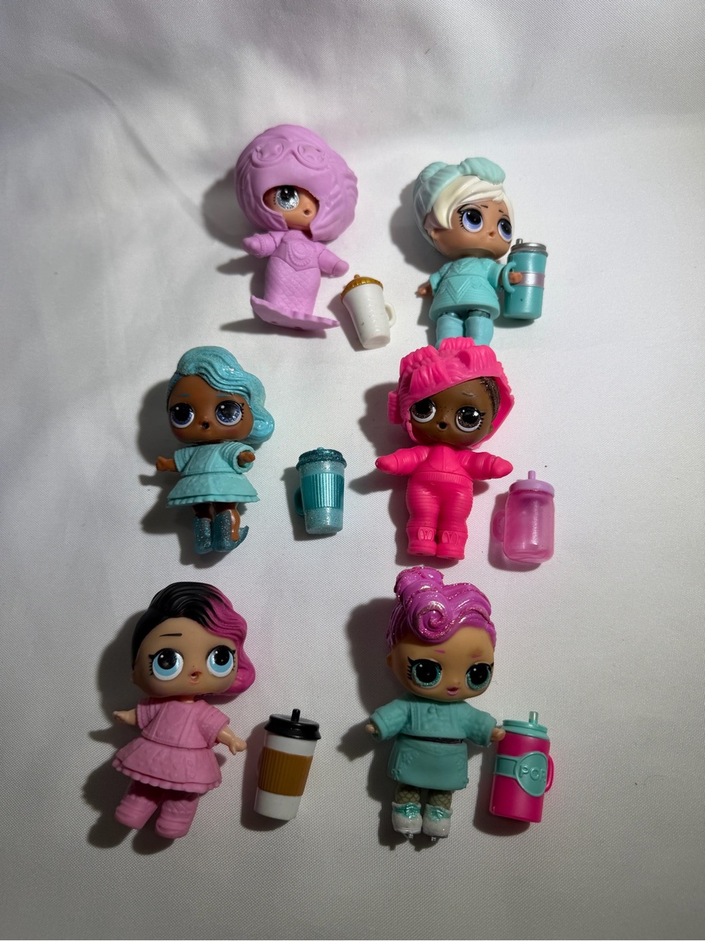 L.O.L. Surprise! Mini Dolls in Pink, Teal, Purple